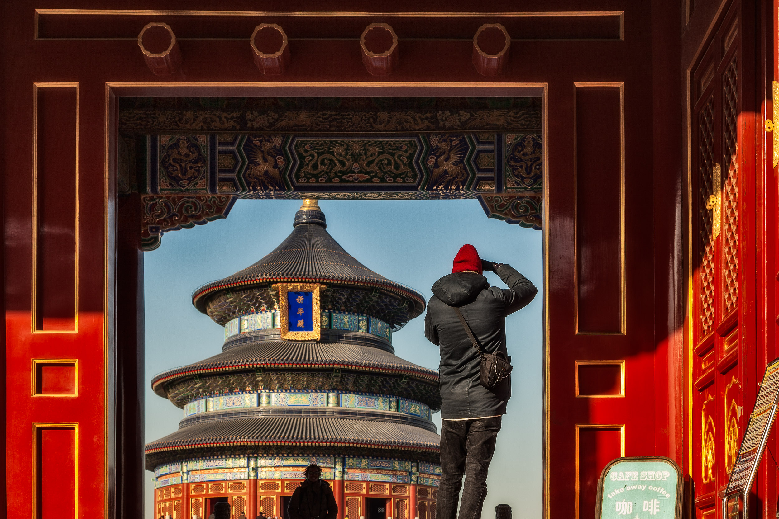 A tourist photograping in the grounds of the spectacular Temple Of Heaven in Beijing, China